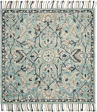 Blossom Collection Handmade Tassel Premium Wool Accent Rug Blue / Ivory