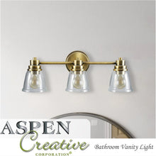 Aspen Creative Three-Light Metal Bathroom Vanity Wall Light Fixture, 24" Wide, Oil Rubbed Bronze with Clear Glass Shade